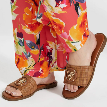 Women magnify woven beach slides